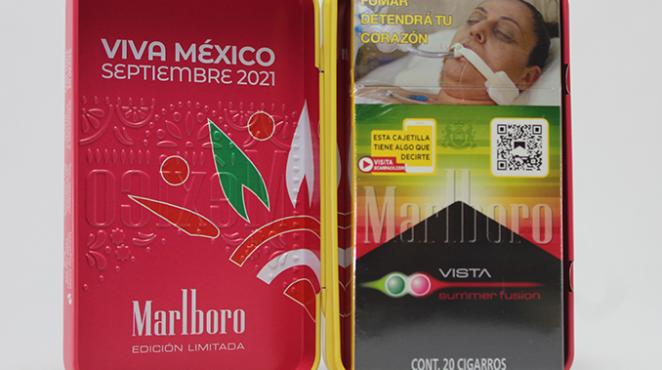 A red hard shell case with Mexican symbols holding a cigarette pack